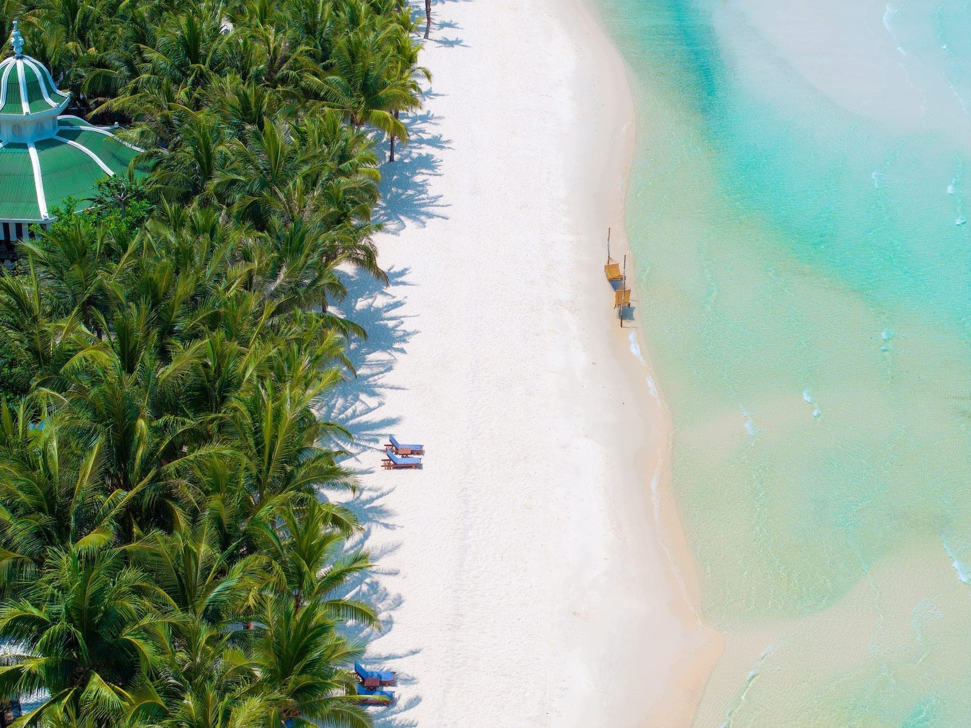 Aerial view of a white sand beach and turquoise water on Phu Quoc