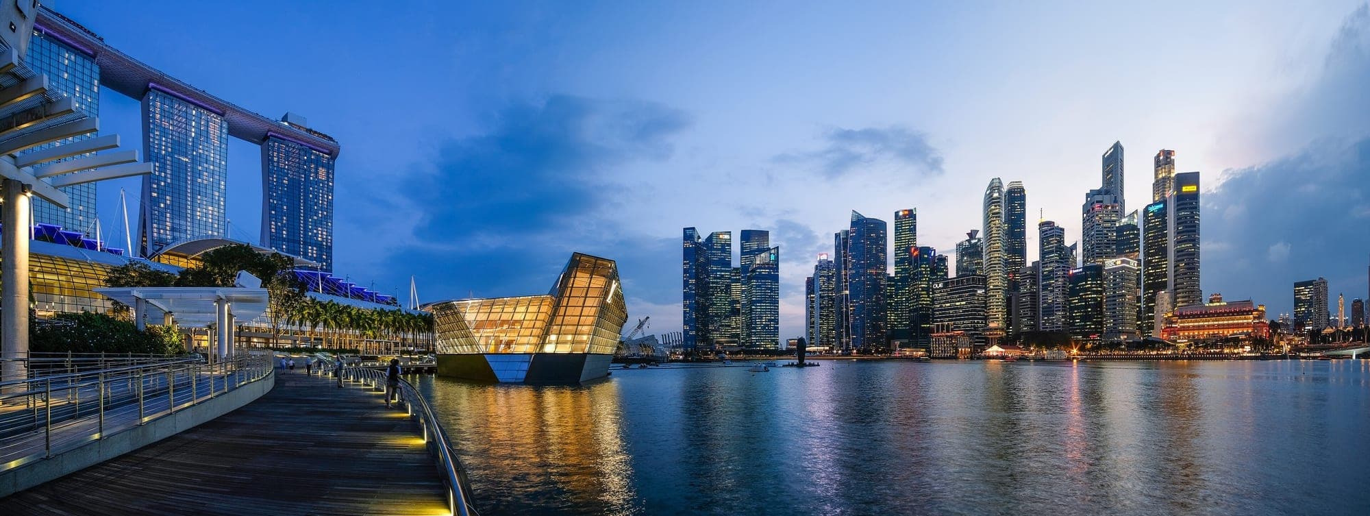 Singapore skyline at dusk across Marina Bay
