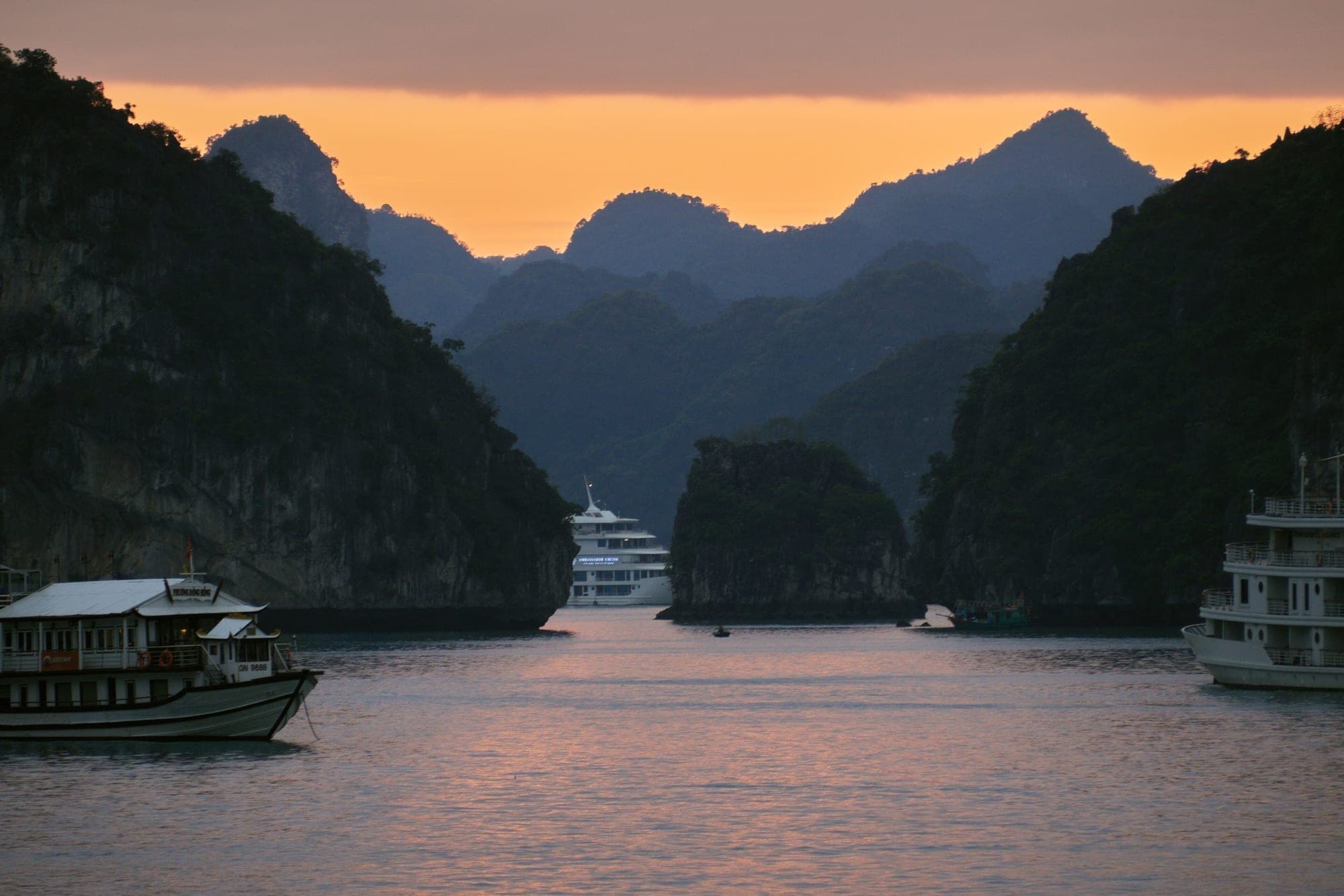 Limestone islands at sunset in Ha Long Bay