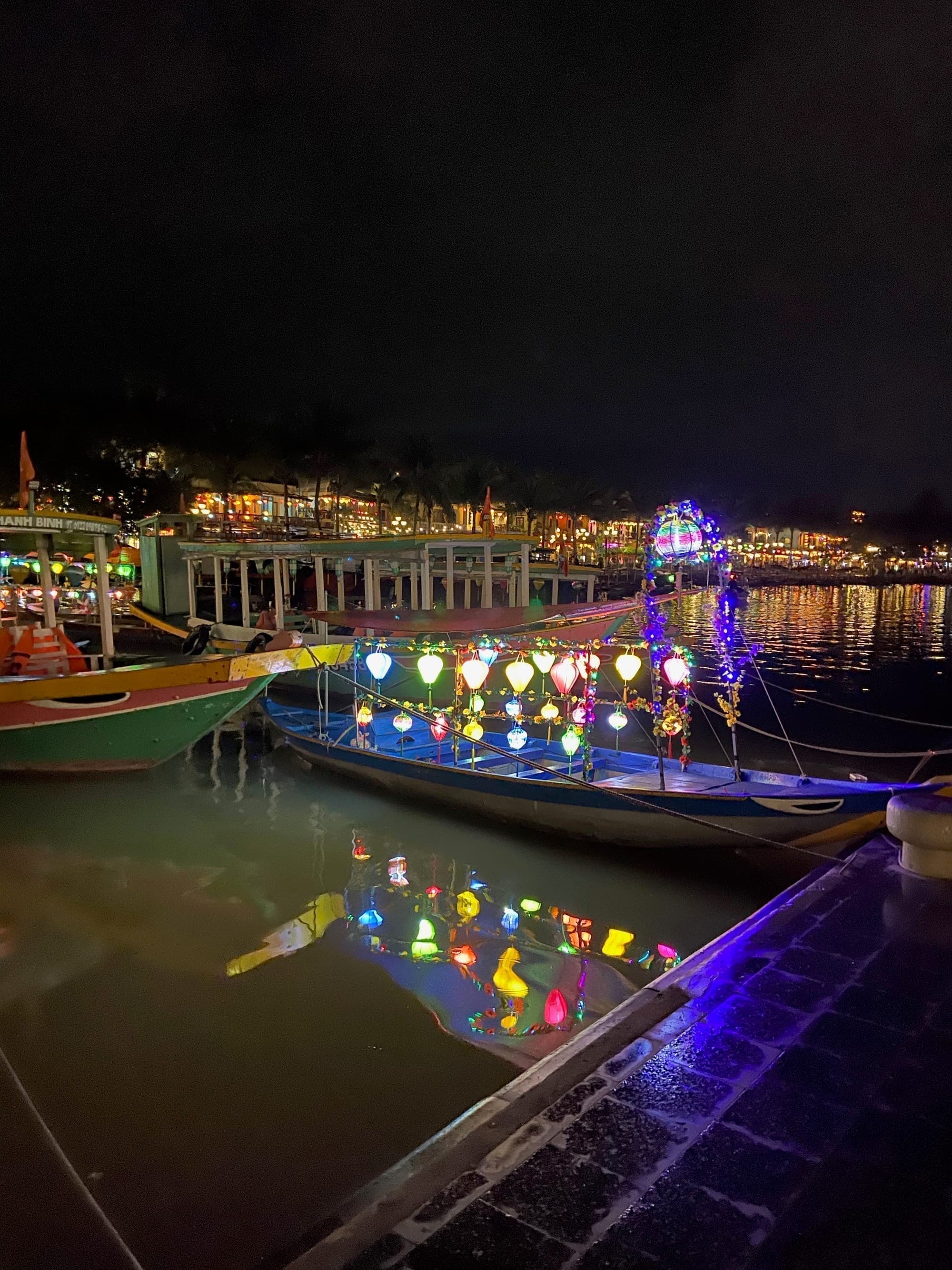 Lantern-lit boats on the river at Hoi An