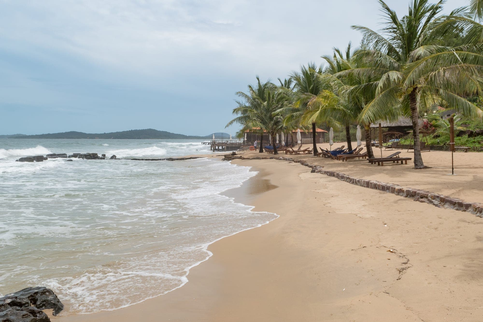 Palm trees along a quiet white sand beach on Phu Quoc