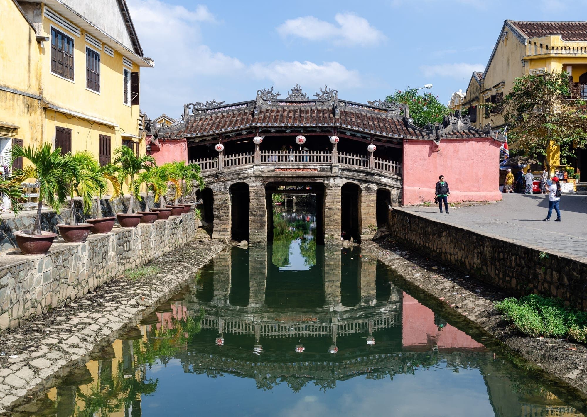 The Japanese Covered Bridge in Hoi An reflected in the water